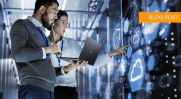 Professionals in a server room, analyzing top managed IT service provider data on a digital screen