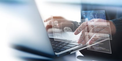 A businessman uses an AI solution, ChatGPT, on a laptop in an office. 