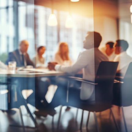 Blurry Office Meeting Through Glass Wall_ Focusing on Corporate Teamwork and Workplace Dynamics. By melhak