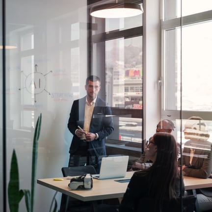 business professionals in a modern office during a strategy meeting