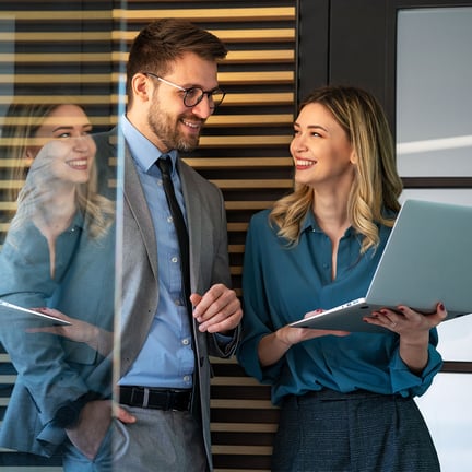 Business professionals collaborating on a project in a modern office