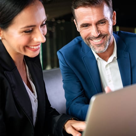 Businessman and businesswoman meeting in a modern office