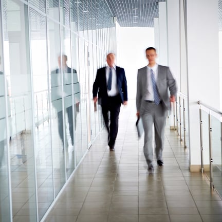 Executives in a fast paced environment inside their office