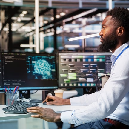 Computer scientist inspecting neural network data center used for machine learning.