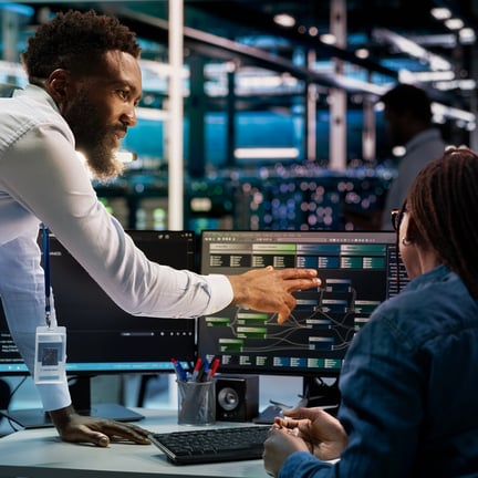 Data center computer scientists setting up machine learning node trees systems handling information.
