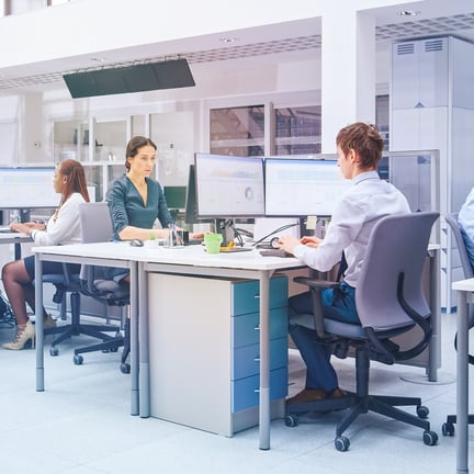 In the Bright Busy Office Rows of Young Professionals Working on Desktop Computers