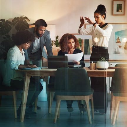 Laptop, planning and business people in meeting, teamwork and communication in modern office