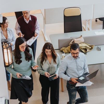 Group of executives working together in an office environment
