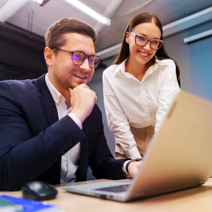 Man and woman business colleague reviewing online business services