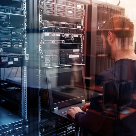 Network engineer working in server room
