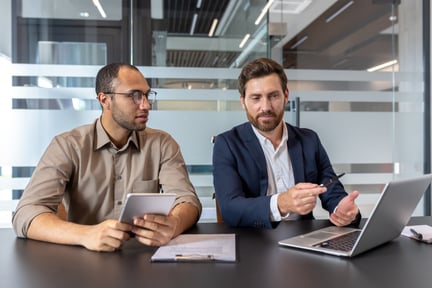 Two men renegotiating MSP contracts