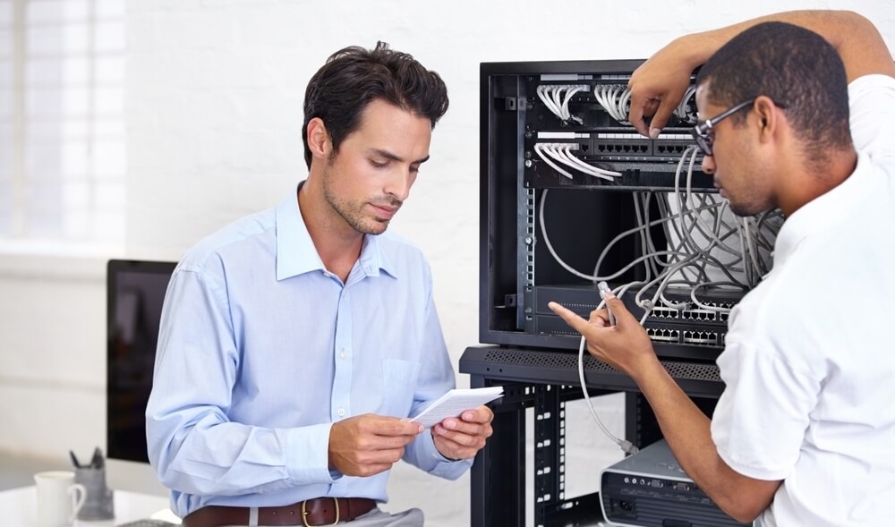 Two IT techs discussing their work